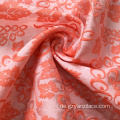 Orangefarbener Jacquard-Stoff mit Seidendruck